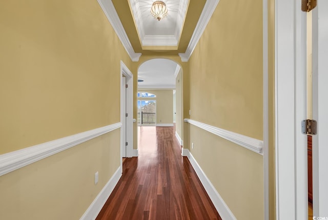 hallway featuring crown molding and dark hardwood / wood-style flooring