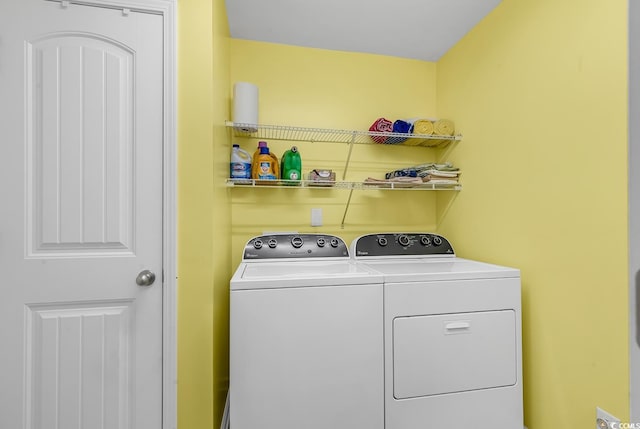 washroom with separate washer and dryer