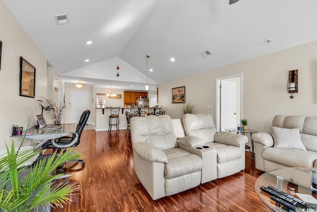 living room featuring vaulted ceiling and dark wood-type flooring