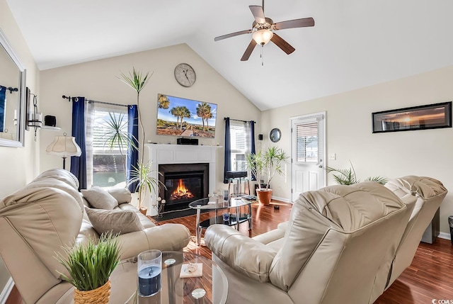 living room featuring ceiling fan, lofted ceiling, and dark hardwood / wood-style floors