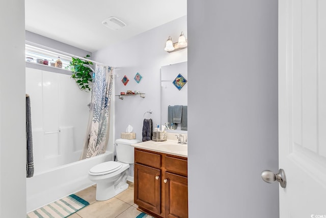 full bathroom with shower / tub combo with curtain, tile patterned floors, toilet, and vanity