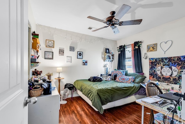 bedroom featuring dark wood-type flooring and ceiling fan