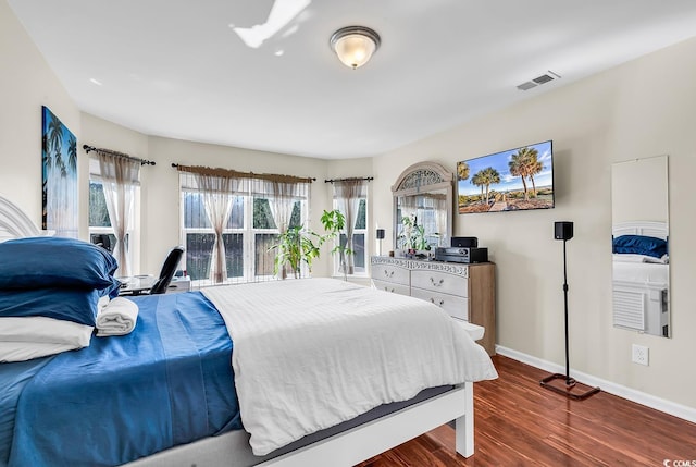 bedroom featuring dark hardwood / wood-style floors