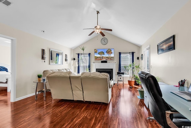 living room featuring ceiling fan, lofted ceiling, and dark hardwood / wood-style floors