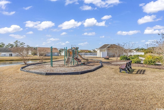 view of jungle gym featuring a water view