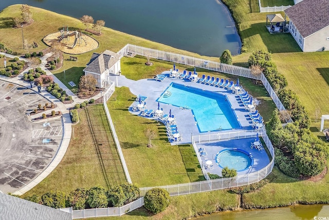 birds eye view of property with a water view