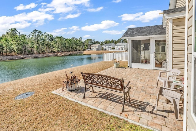 view of patio featuring a water view