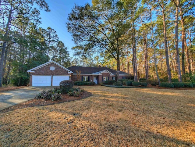 single story home with a garage and a front yard