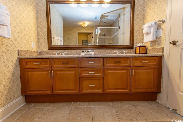 bathroom featuring vanity and a shower with door