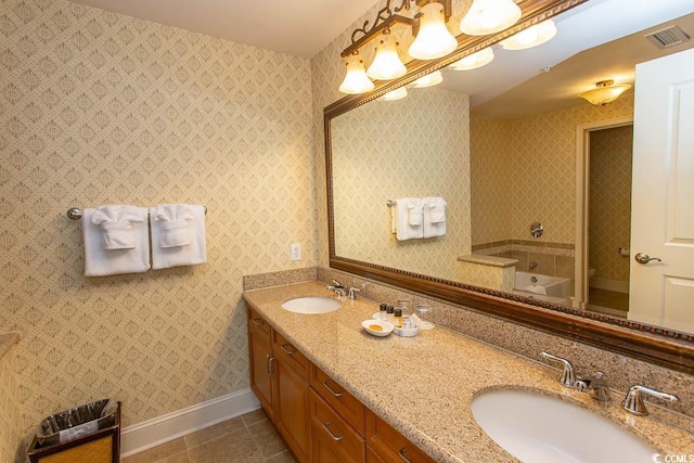 bathroom with tile patterned floors and vanity