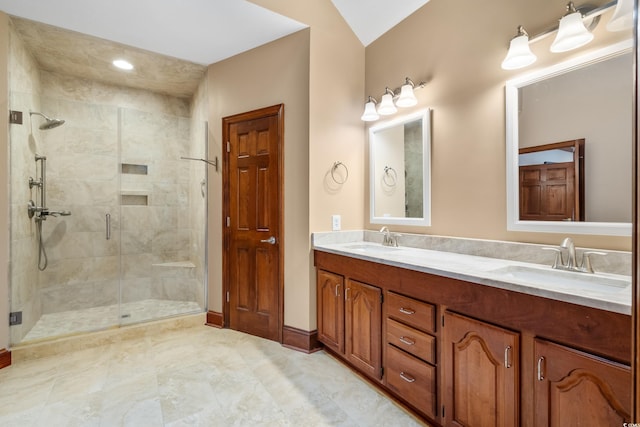 bathroom featuring vanity and an enclosed shower