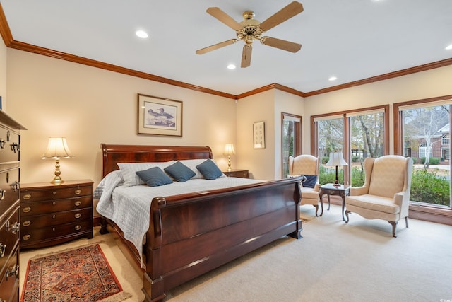 bedroom featuring crown molding, light colored carpet, and ceiling fan