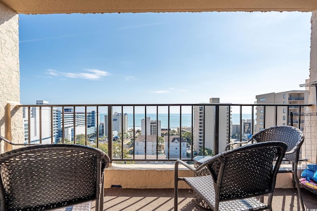 balcony featuring a water view