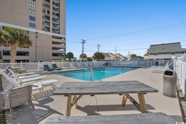 view of swimming pool featuring a patio area