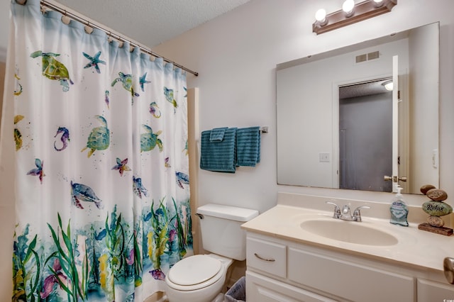 bathroom featuring vanity, toilet, a textured ceiling, and a shower with shower curtain