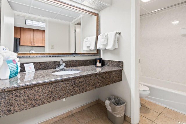 1105 S Ocean Blvd Unit 1134, Myrtle Beach, SC 29577 - full bathroom featuring tile patterned flooring, sink, washtub / shower combination, and toilet