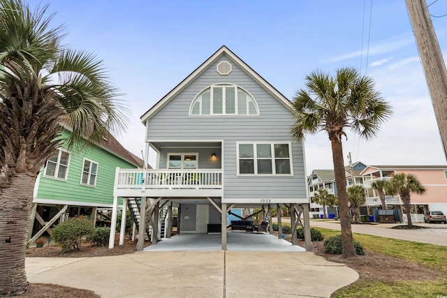 coastal home featuring a carport and a porch