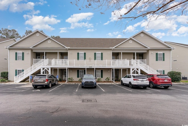 130 Lazy Willow Ln Unit 204, Myrtle Beach, SC 29588 - view of building exterior featuring uncovered parking and stairway