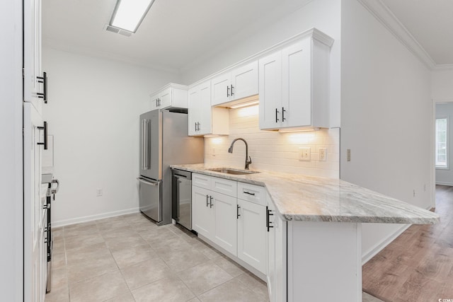 130 Lazy Willow Ln Unit 204, Myrtle Beach, SC 29588 - kitchen with a sink, white cabinetry, decorative backsplash, dishwasher, and ornamental molding