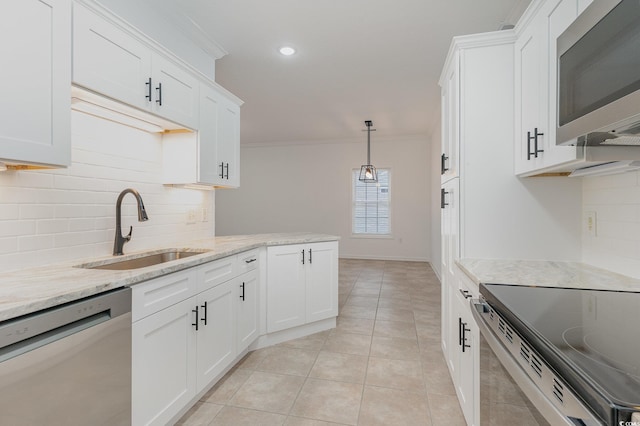 130 Lazy Willow Ln Unit 204, Myrtle Beach, SC 29588 - kitchen featuring crown molding, tasteful backsplash, stainless steel appliances, and a sink