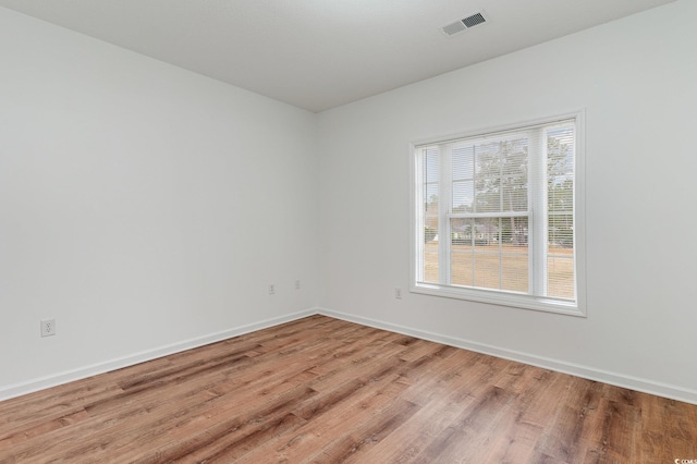 130 Lazy Willow Ln Unit 204, Myrtle Beach, SC 29588 - unfurnished room featuring baseboards, wood finished floors, and visible vents