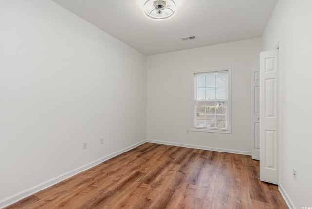 130 Lazy Willow Ln Unit 204, Myrtle Beach, SC 29588 - unfurnished room with baseboards, light wood-style floors, and visible vents