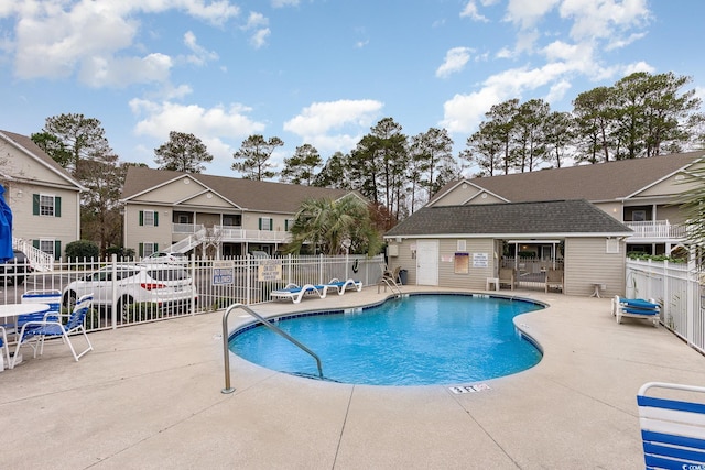 130 Lazy Willow Ln Unit 204, Myrtle Beach, SC 29588 - community pool with a residential view, a patio area, and fence