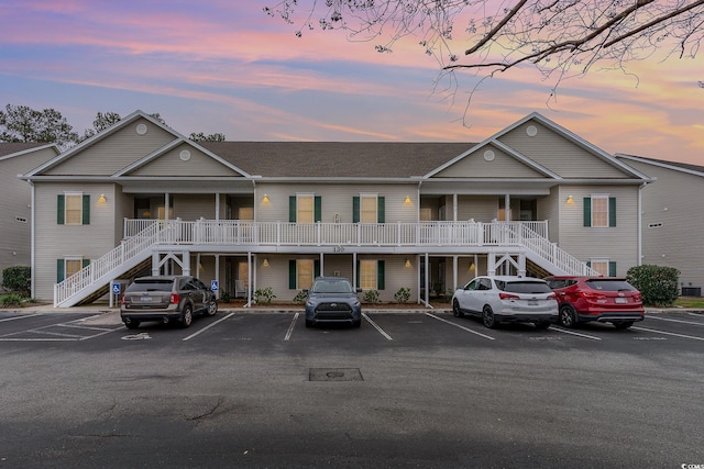 130 Lazy Willow Ln Unit 204, Myrtle Beach, SC 29588 - view of property with stairs and uncovered parking