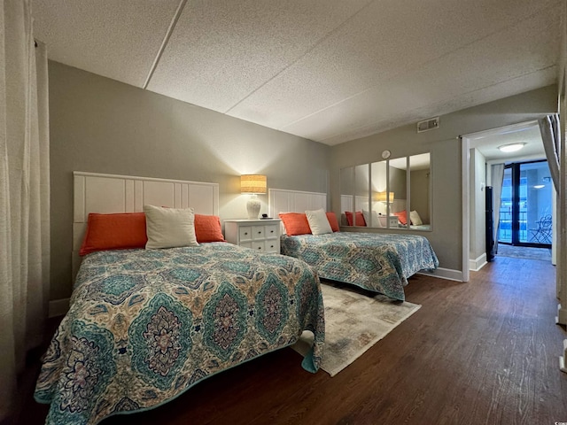 bedroom featuring dark hardwood / wood-style floors and french doors