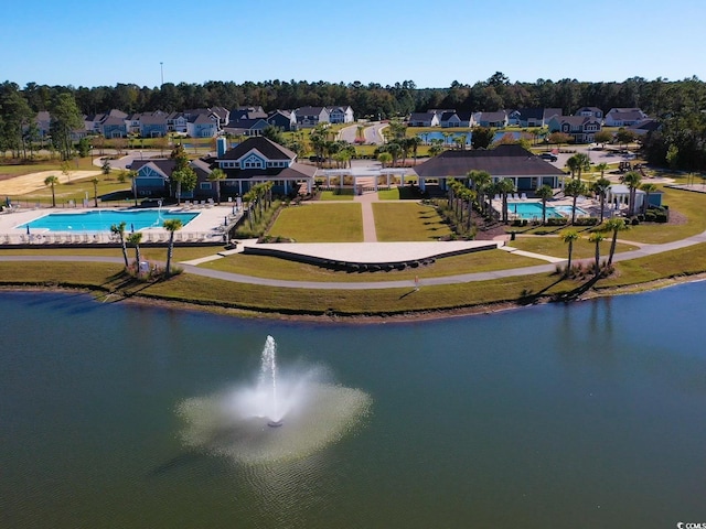 drone / aerial view featuring a water view and a residential view