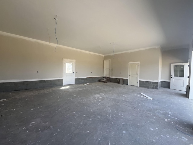 unfurnished room featuring unfinished concrete floors