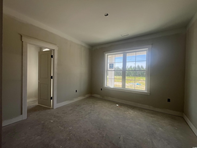 spare room featuring baseboards