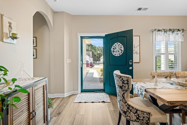 foyer entrance featuring plenty of natural light and light hardwood / wood-style flooring