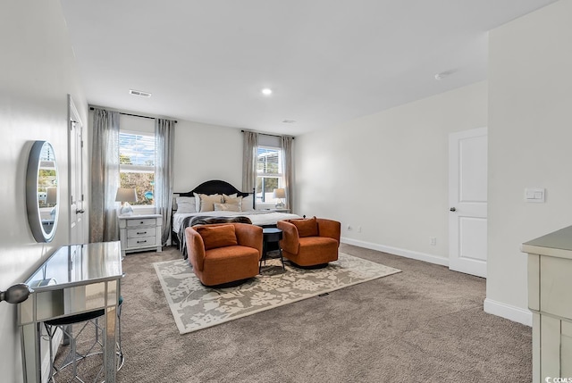 bedroom with light colored carpet