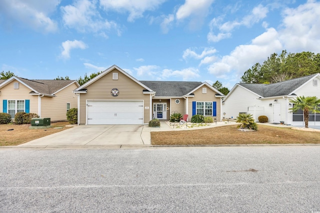 view of front of house with a garage and driveway