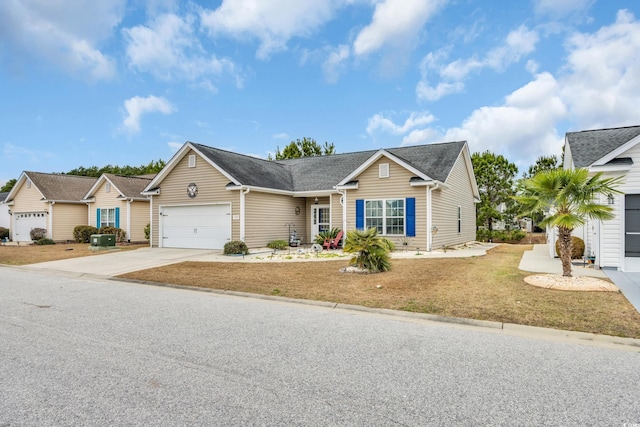 single story home featuring a garage, concrete driveway, and a front yard