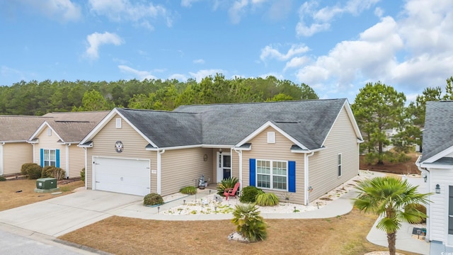 single story home with driveway and roof with shingles