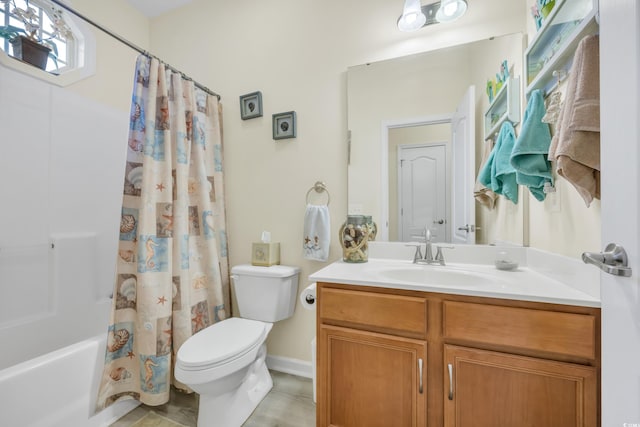 bathroom with vanity, toilet, and shower / bath combo with shower curtain