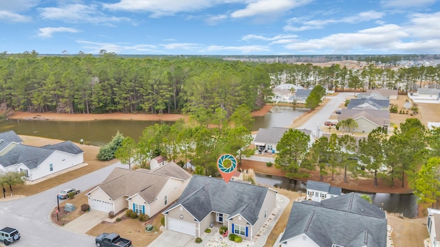 bird's eye view featuring a water view and a residential view