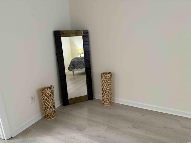 3700 Golf Colony Dr Unit 26G, Little River, SC 29566 - unfurnished room featuring baseboards and light wood-style floors