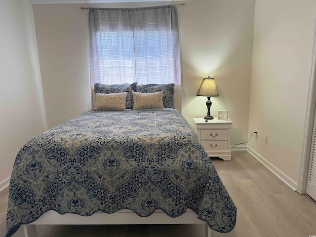 3700 Golf Colony Dr Unit 26G, Little River, SC 29566 - bedroom featuring light wood-type flooring and baseboards