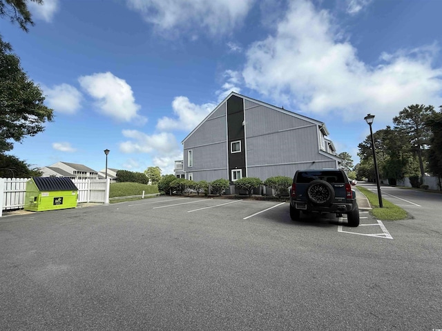 3700 Golf Colony Dr Unit 26G, Little River, SC 29566 - uncovered parking lot with fence