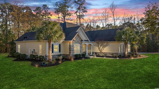 view of front of property with a lawn