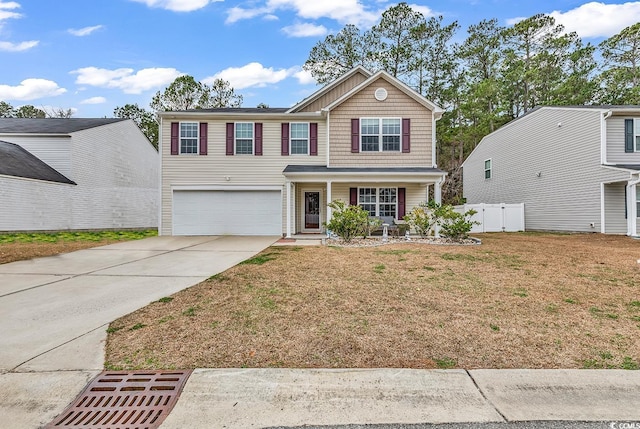 145 Bendick Ct, Little River, SC 29566 - traditional-style home with a garage, covered porch, fence, a front lawn, and driveway