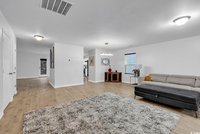 145 Bendick Ct, Little River, SC 29566 - living room with light wood-type flooring, baseboards, and visible vents