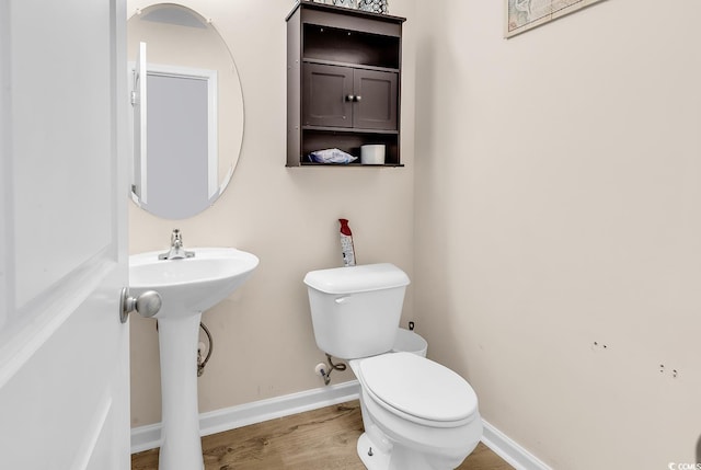 145 Bendick Ct, Little River, SC 29566 - bathroom featuring toilet, wood finished floors, and baseboards