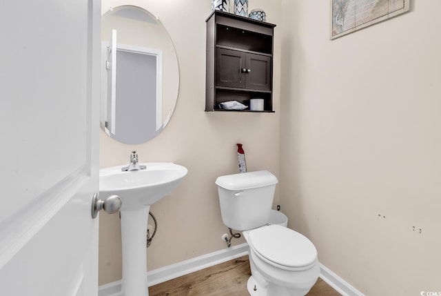 145 Bendick Ct, Little River, SC 29566 - bathroom featuring baseboards, toilet, and wood finished floors