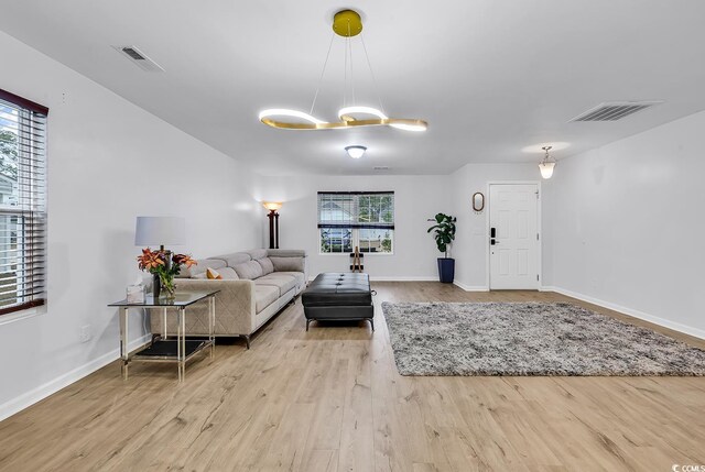 145 Bendick Ct, Little River, SC 29566 - living room featuring visible vents, baseboards, and wood finished floors