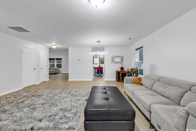 145 Bendick Ct, Little River, SC 29566 - living room with visible vents, baseboards, and light wood-style floors