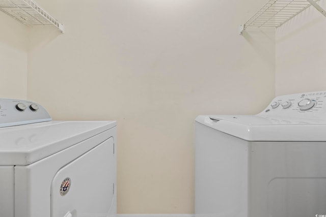 washroom with laundry area and washing machine and clothes dryer